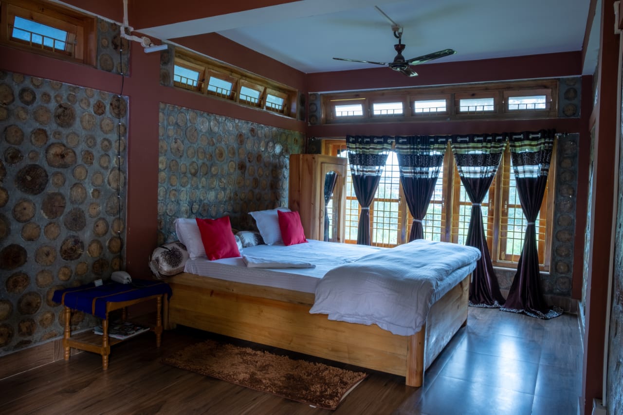 Premium homestay bedroom in Ziro with wooden interiors