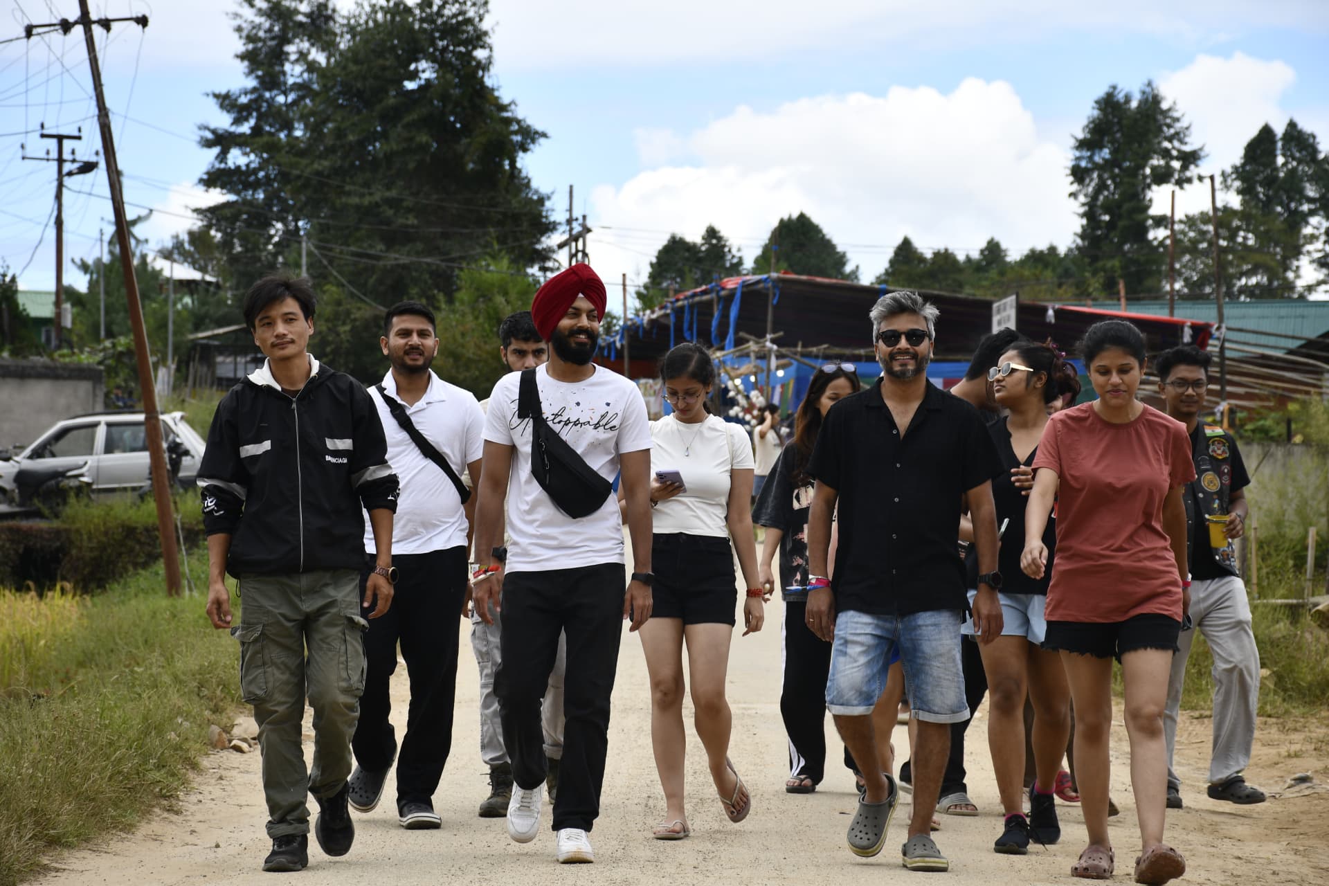 Travellers walking through Ziro village lanes