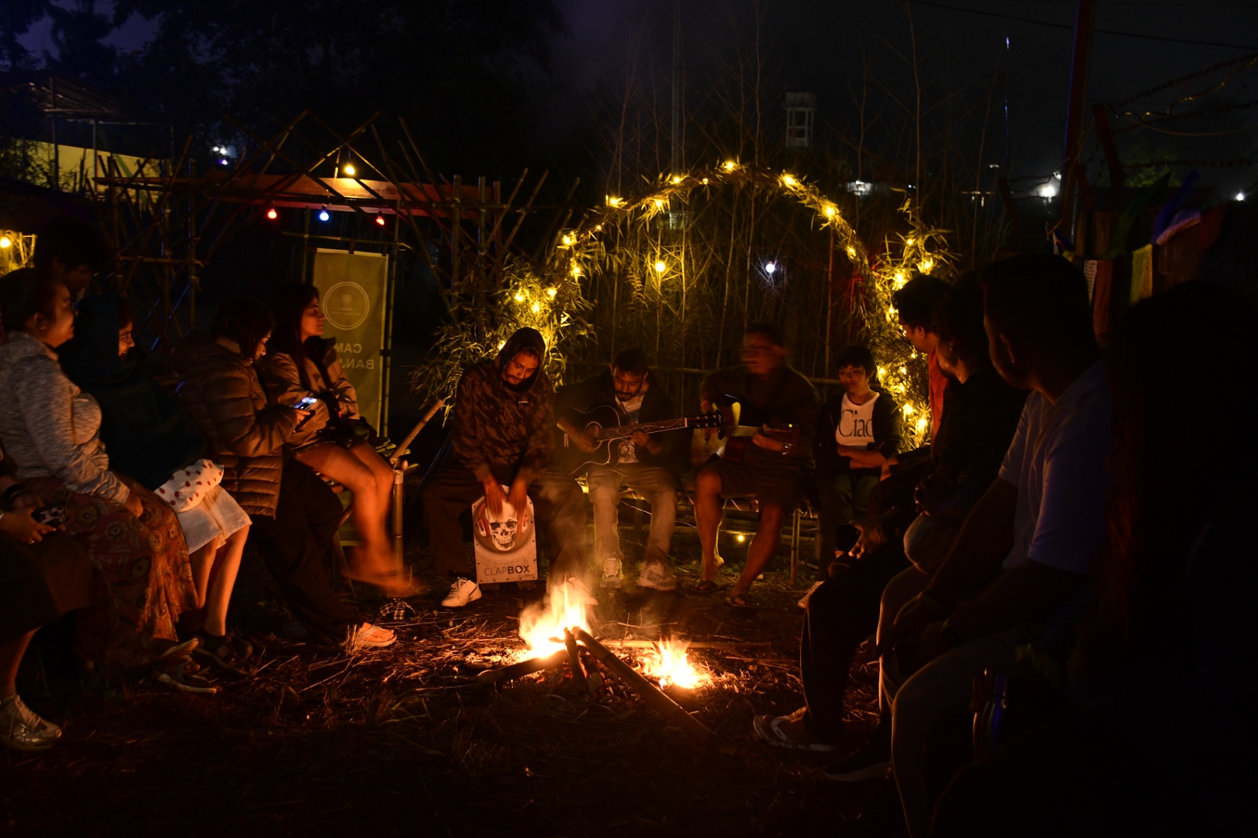 BreakBag guests around a campfire jam at Ziro